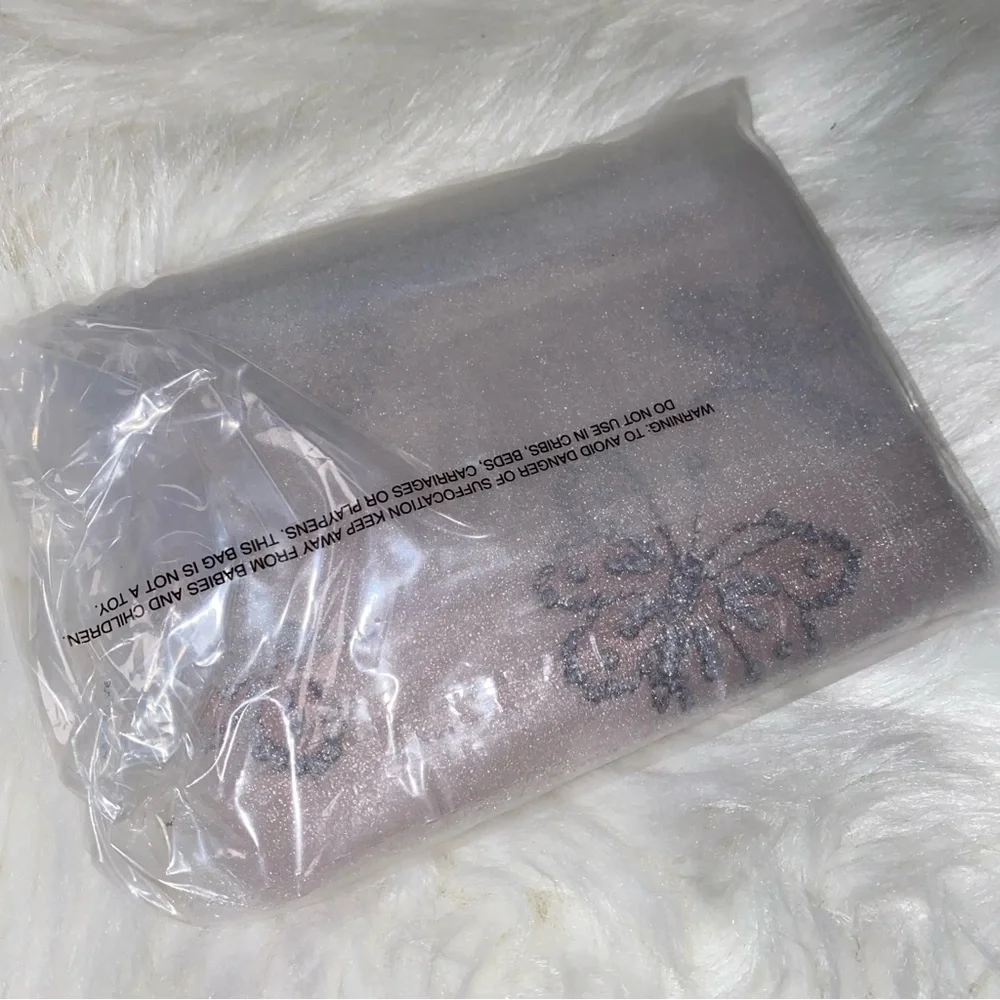 Coach leather wristlet with butterflies New